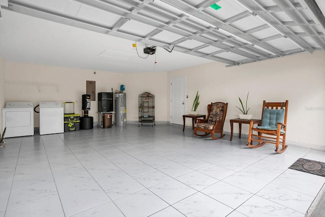 garage with a garage door opener, separate washer and dryer, white refrigerator, and electric water heater