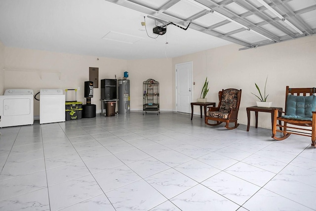 garage with a garage door opener, independent washer and dryer, and water heater