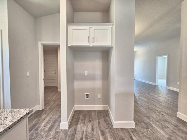 mudroom featuring dark wood-style floors and baseboards