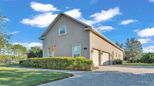 view of home's exterior featuring a yard and a garage