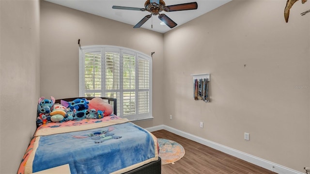 bedroom featuring wood-type flooring and ceiling fan