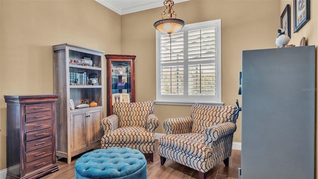 living area with ornamental molding and wood-type flooring