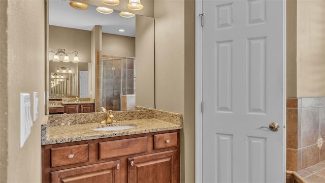 bathroom with vanity and walk in shower