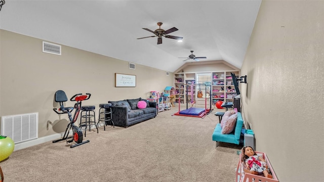 playroom featuring ceiling fan, carpet flooring, and lofted ceiling