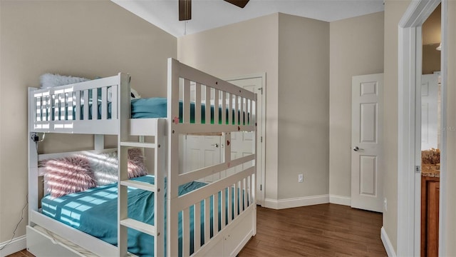 bedroom with ceiling fan and dark hardwood / wood-style flooring