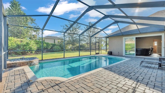 view of swimming pool with cooling unit, a patio area, glass enclosure, and a jacuzzi