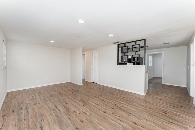 unfurnished living room with light hardwood / wood-style floors