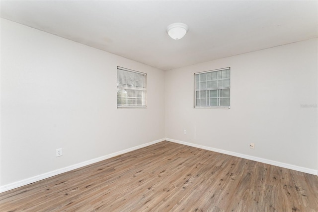 unfurnished room featuring light wood-type flooring