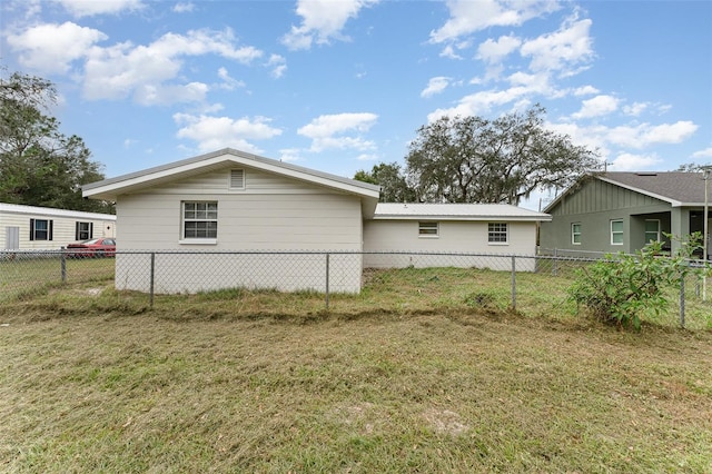 view of property exterior featuring a lawn