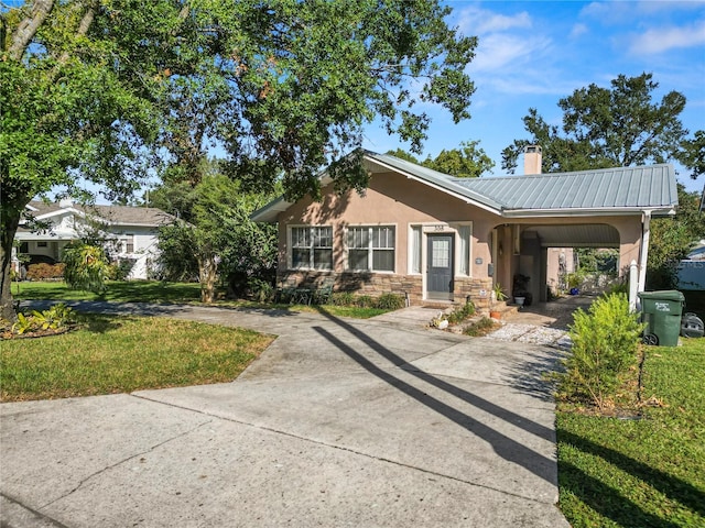 ranch-style home with a front lawn and a carport