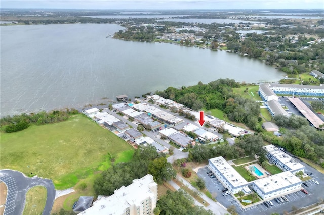 birds eye view of property with a water view