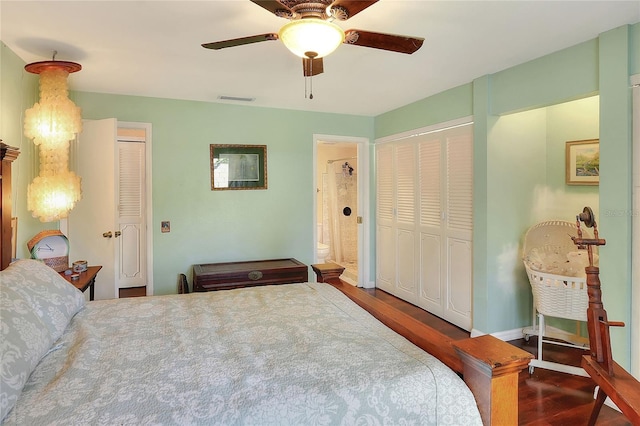 bedroom featuring ceiling fan and dark wood-type flooring