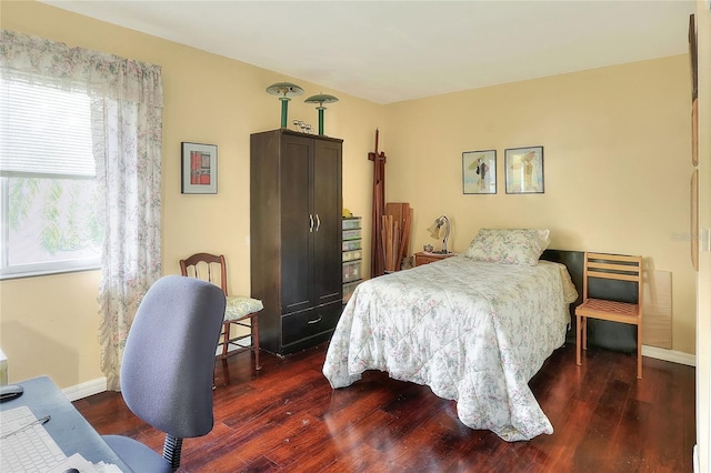 bedroom featuring dark wood-type flooring