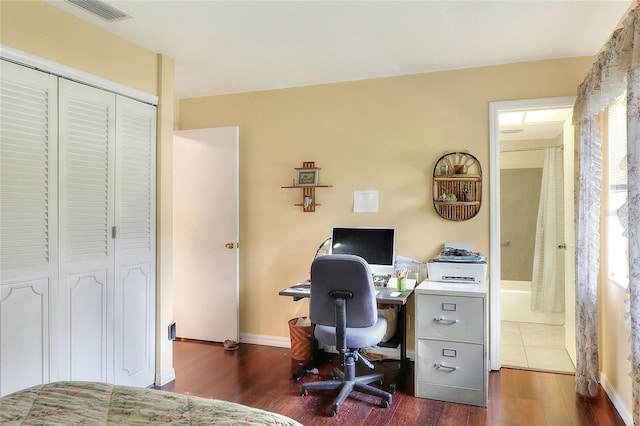 office with dark hardwood / wood-style flooring