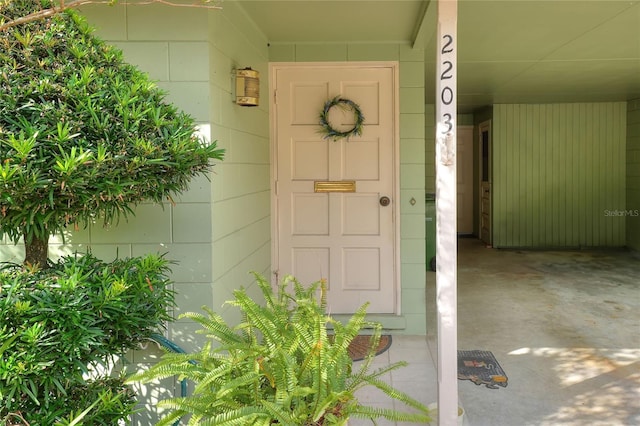 entrance to property with concrete block siding