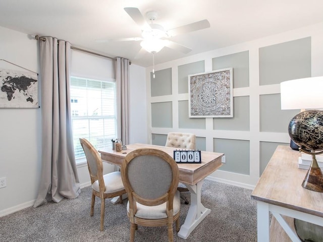 carpeted office featuring ceiling fan