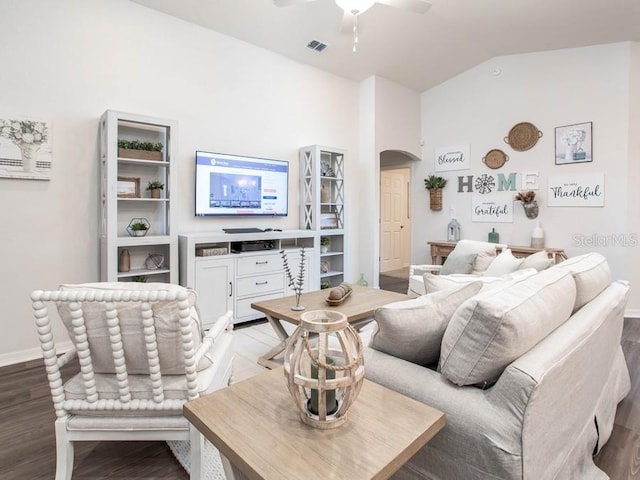 living room with light hardwood / wood-style floors, lofted ceiling, and ceiling fan