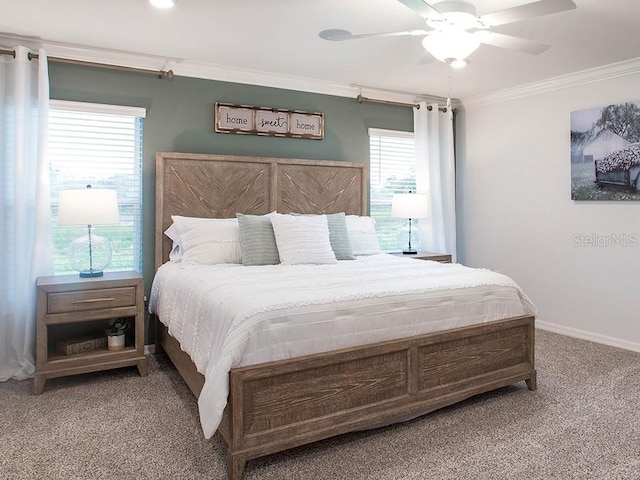 bedroom with multiple windows, ornamental molding, carpet flooring, and ceiling fan