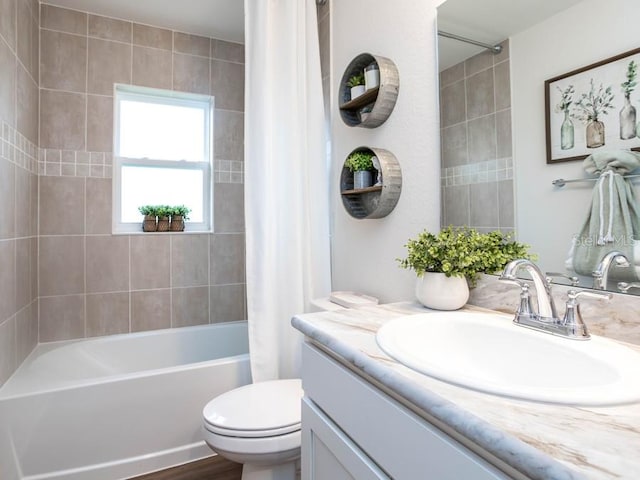 full bathroom featuring toilet, shower / tub combo with curtain, vanity, and wood-type flooring