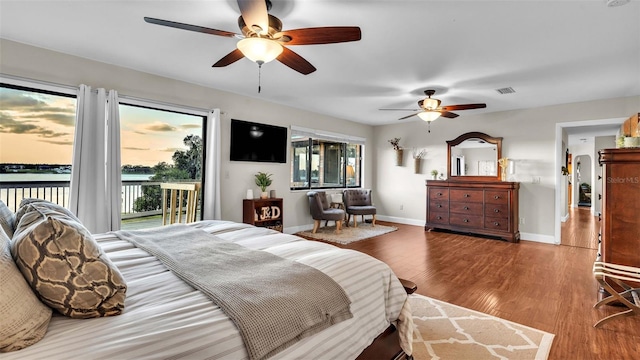 bedroom featuring ceiling fan, hardwood / wood-style floors, and access to outside