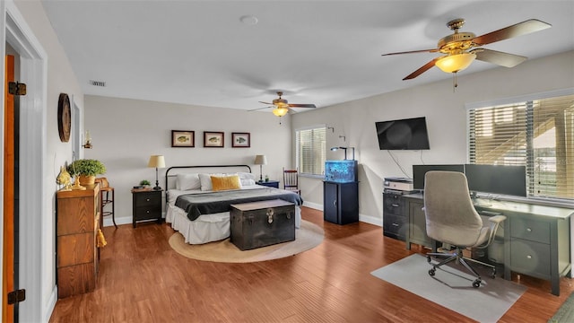 bedroom with ceiling fan and hardwood / wood-style floors