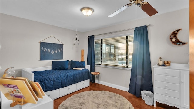 bedroom featuring ceiling fan and hardwood / wood-style flooring