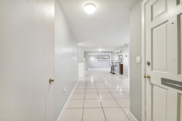 hall featuring light tile patterned floors