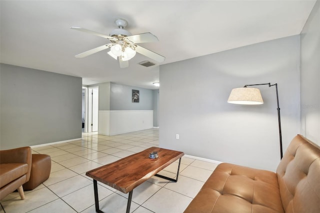 living room featuring ceiling fan and light tile patterned floors