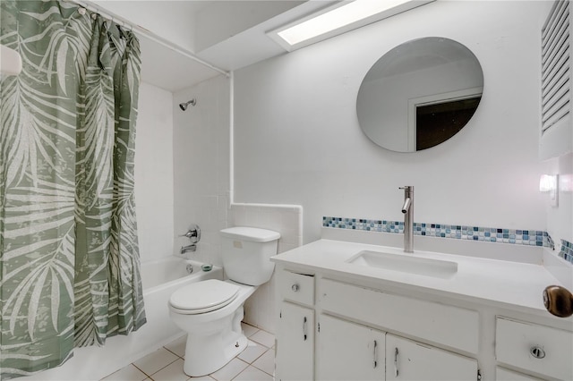 full bathroom featuring shower / bath combo, tile walls, vanity, tile patterned floors, and toilet