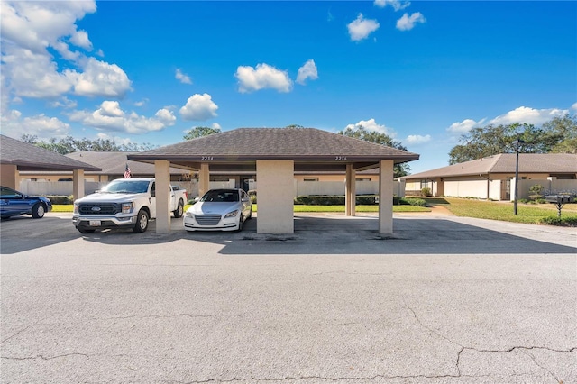 view of partially covered parking lot