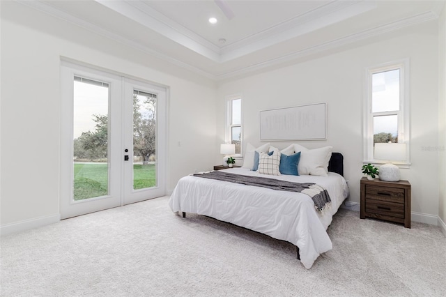 bedroom featuring french doors, multiple windows, and light colored carpet