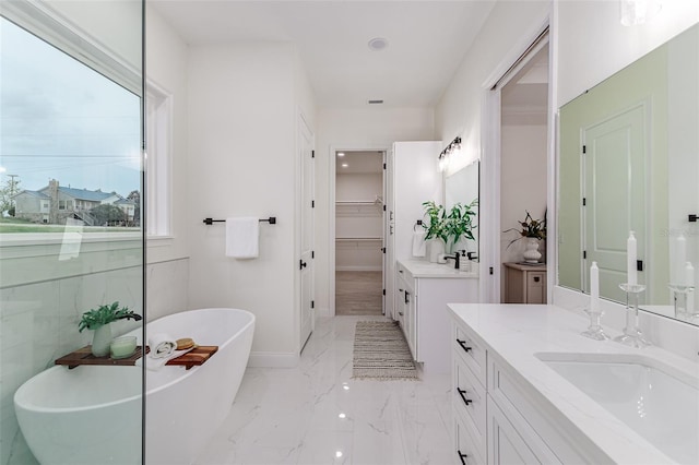 bathroom with vanity and a bathtub