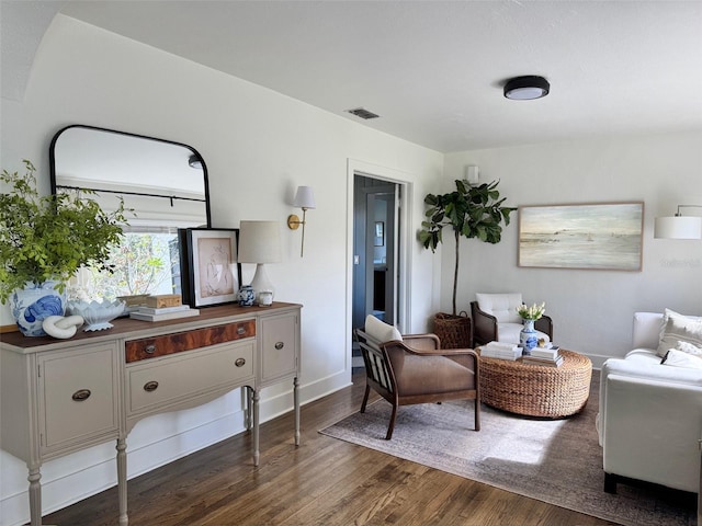 sitting room featuring dark hardwood / wood-style flooring