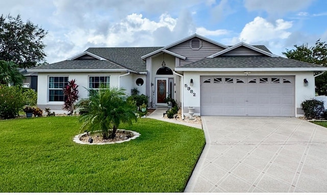 ranch-style home featuring a garage and a front yard