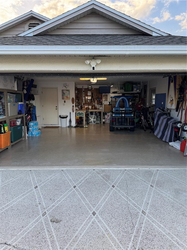 garage featuring driveway