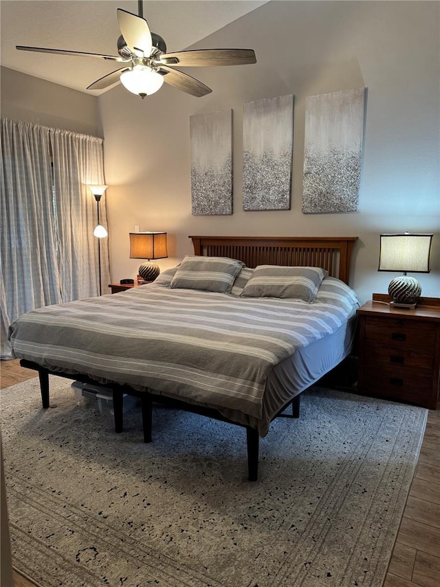 bedroom featuring a ceiling fan and wood finished floors