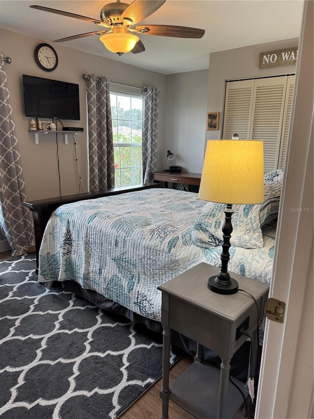 bedroom featuring ceiling fan and wood finished floors