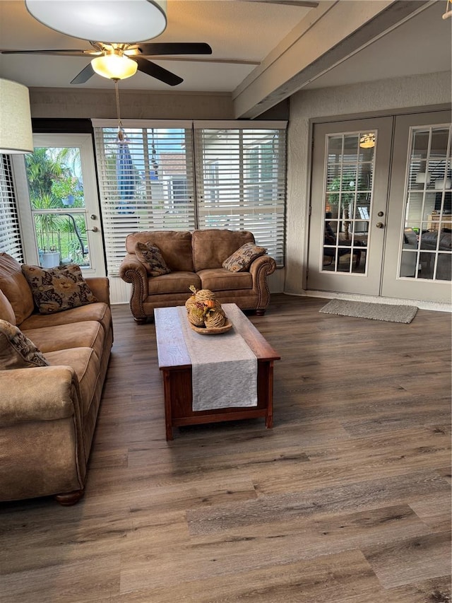 living area featuring french doors, wood finished floors, and a ceiling fan