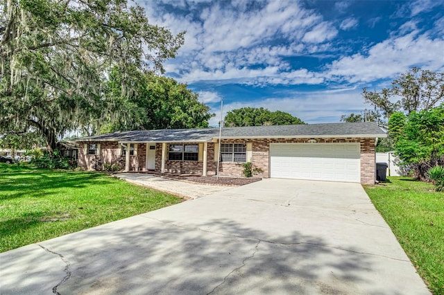 single story home featuring a front yard and a garage