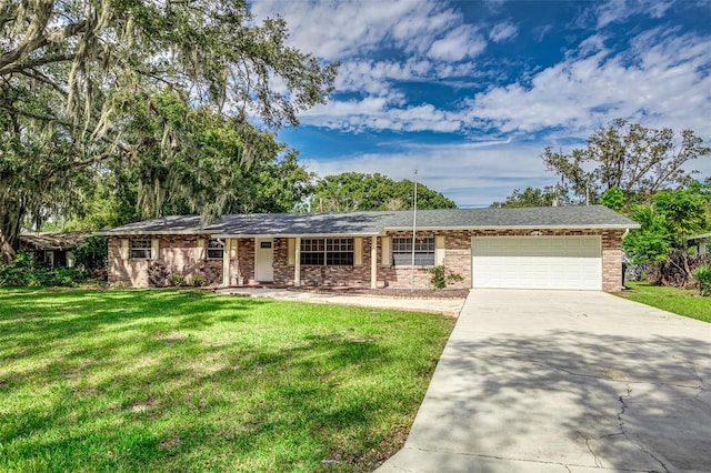 ranch-style home with a front yard and a garage