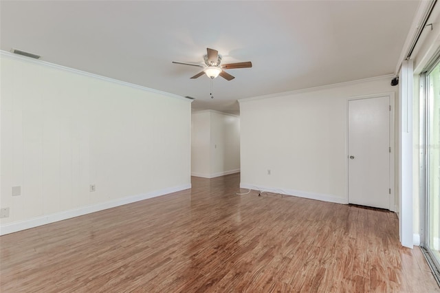 empty room with light hardwood / wood-style flooring, ornamental molding, and ceiling fan