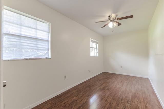 spare room with hardwood / wood-style floors and ceiling fan