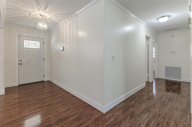 entrance foyer featuring crown molding, a notable chandelier, and dark hardwood / wood-style flooring