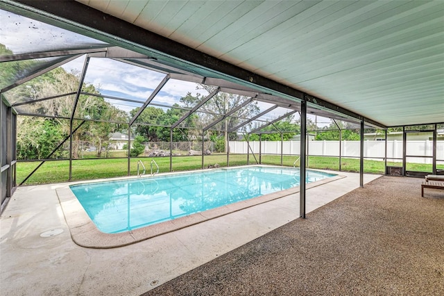 view of pool with a patio area, a lanai, and a yard