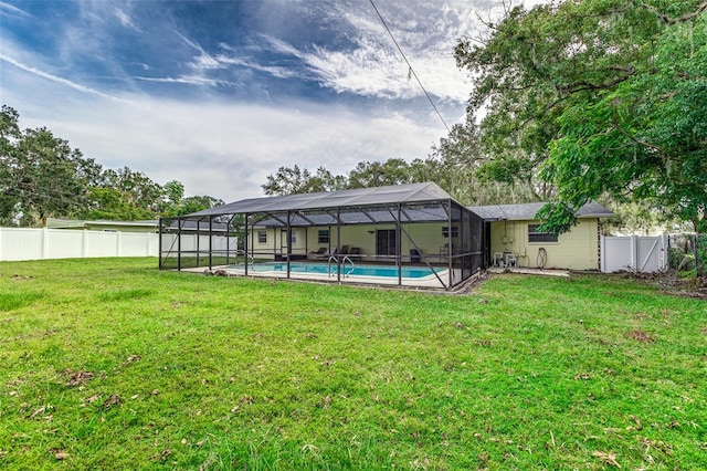 view of yard featuring a fenced in pool and a lanai