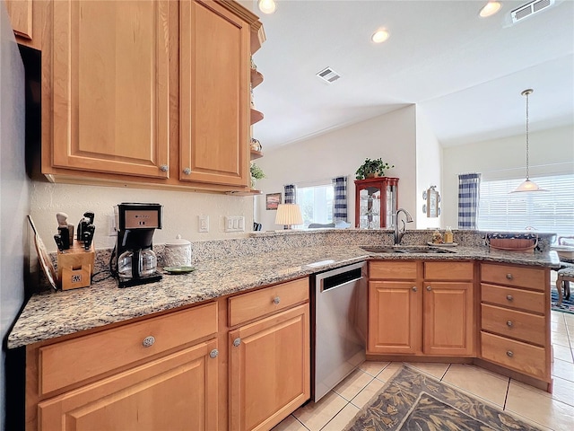 kitchen with kitchen peninsula, sink, light stone countertops, light tile patterned flooring, and stainless steel dishwasher