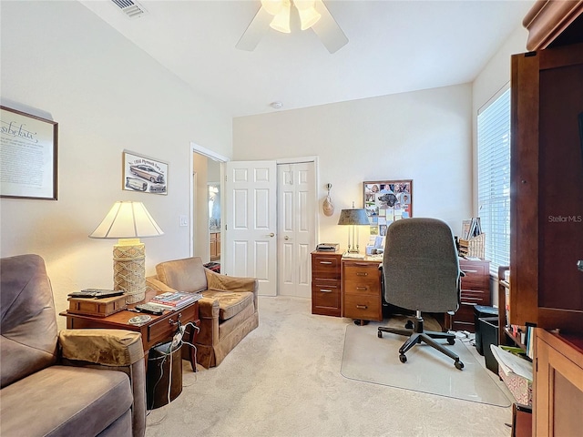 home office featuring ceiling fan and light colored carpet