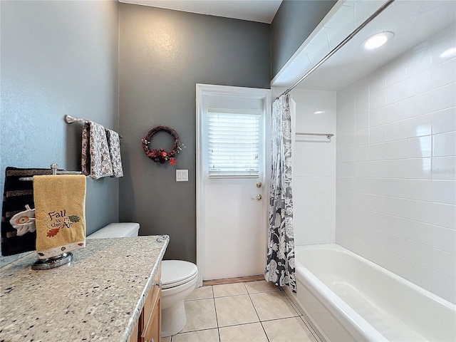 full bathroom featuring vanity, toilet, tile patterned floors, and shower / tub combo