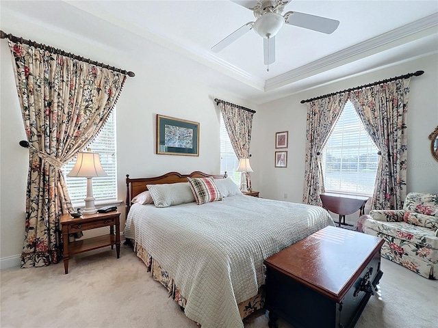 carpeted bedroom with crown molding and ceiling fan