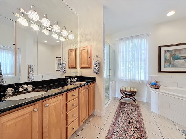 bathroom with vanity, independent shower and bath, and tile patterned flooring